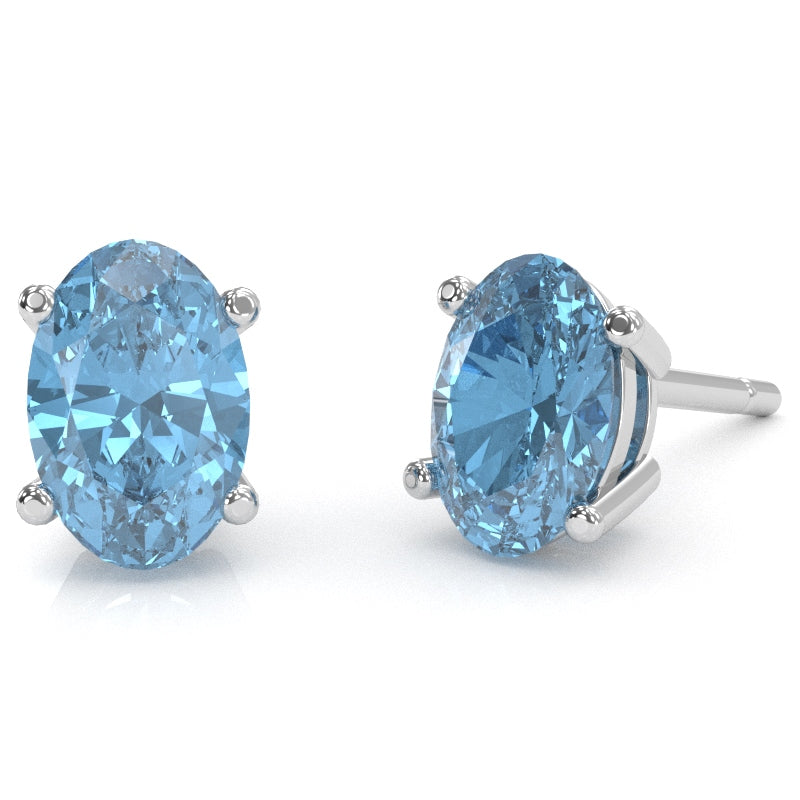 Blue Topaz 7x5mm Oval Stud Earrings in 14k White Gold