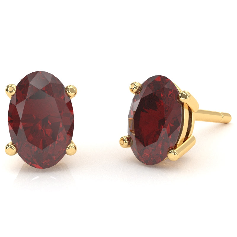 Lab-Created Ruby 7x5mm Oval Stud Earrings in 14k Yellow Gold