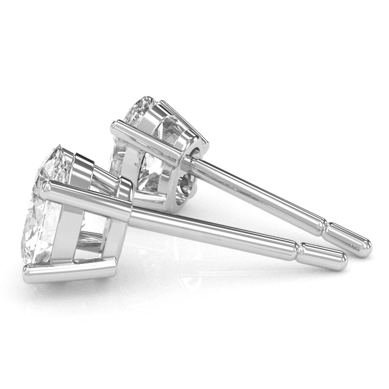 White Topaz 7x5mm Oval Stud Earrings in 14k White Gold