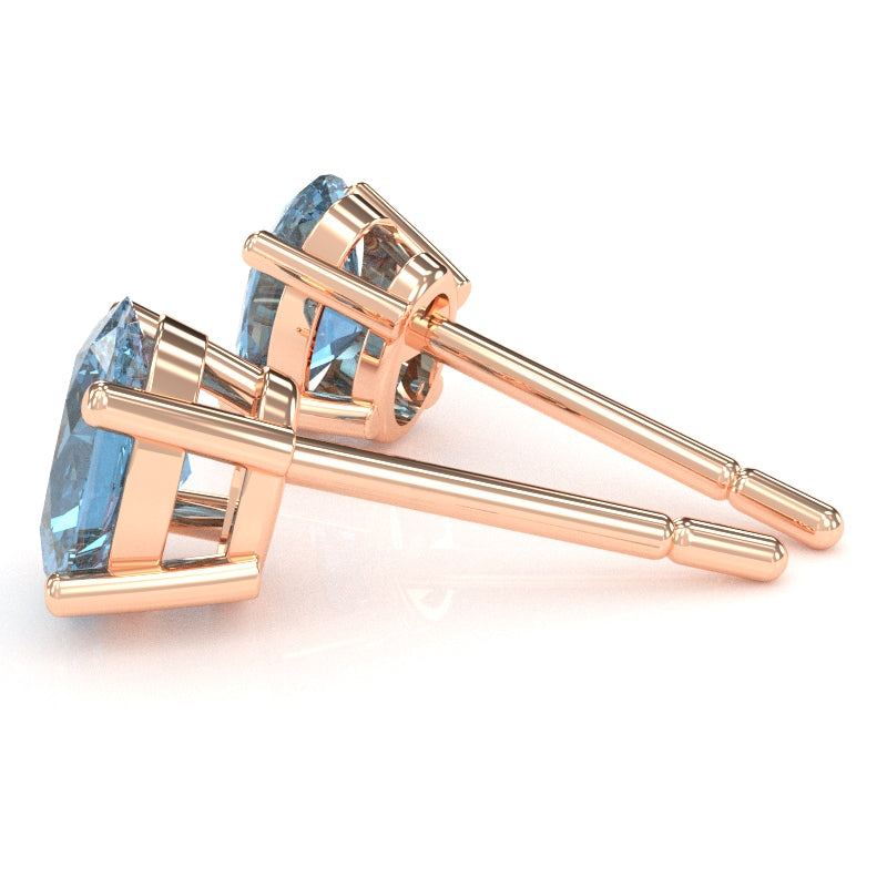 Blue Topaz 7x5mm Oval Stud Earrings in 10k Rose Gold